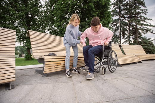 A support worker assisting a person with a disability