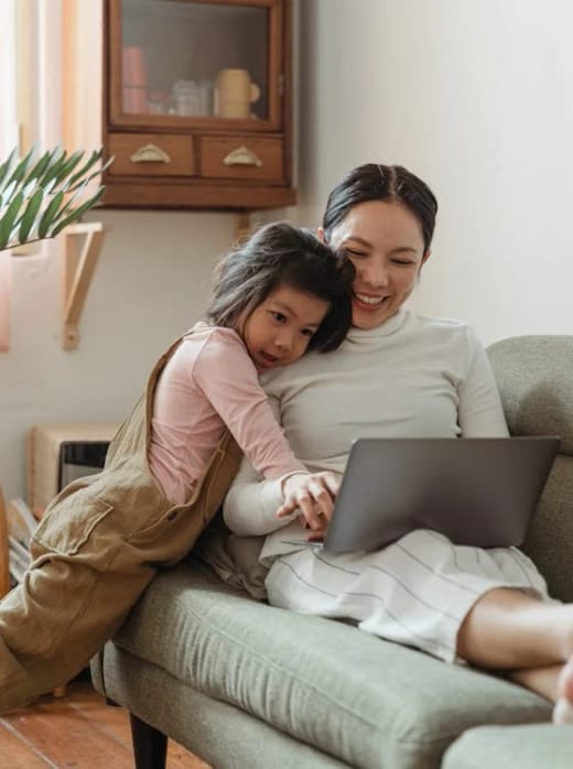 A carer providing in-home support in a client’s living room