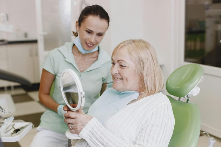 Carer holding the hand of a person receiving support