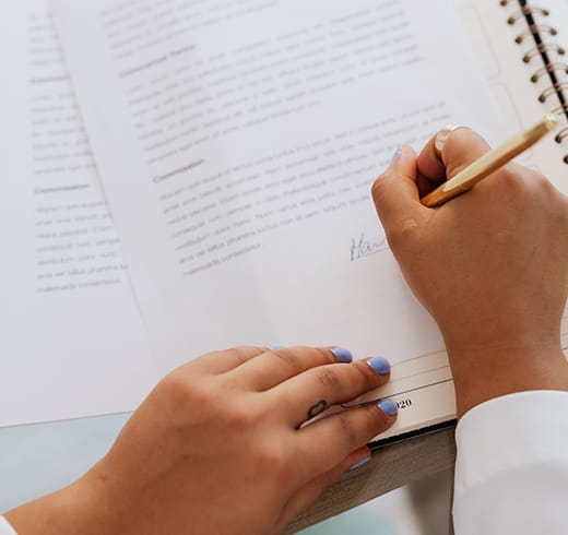 A person reviewing and signing NDIS documentation
