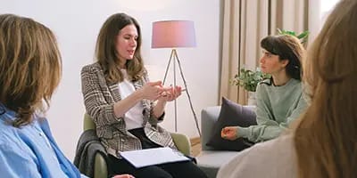 An NDIS coordinator meeting with a family in their home